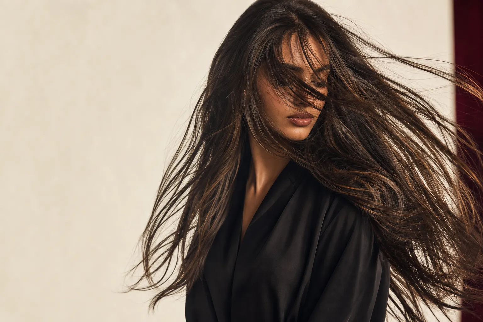 Model with long brunette hair in motion